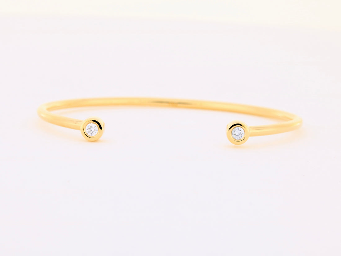 Armspange aus 18kt Gelbgold mit zwei Brillanten