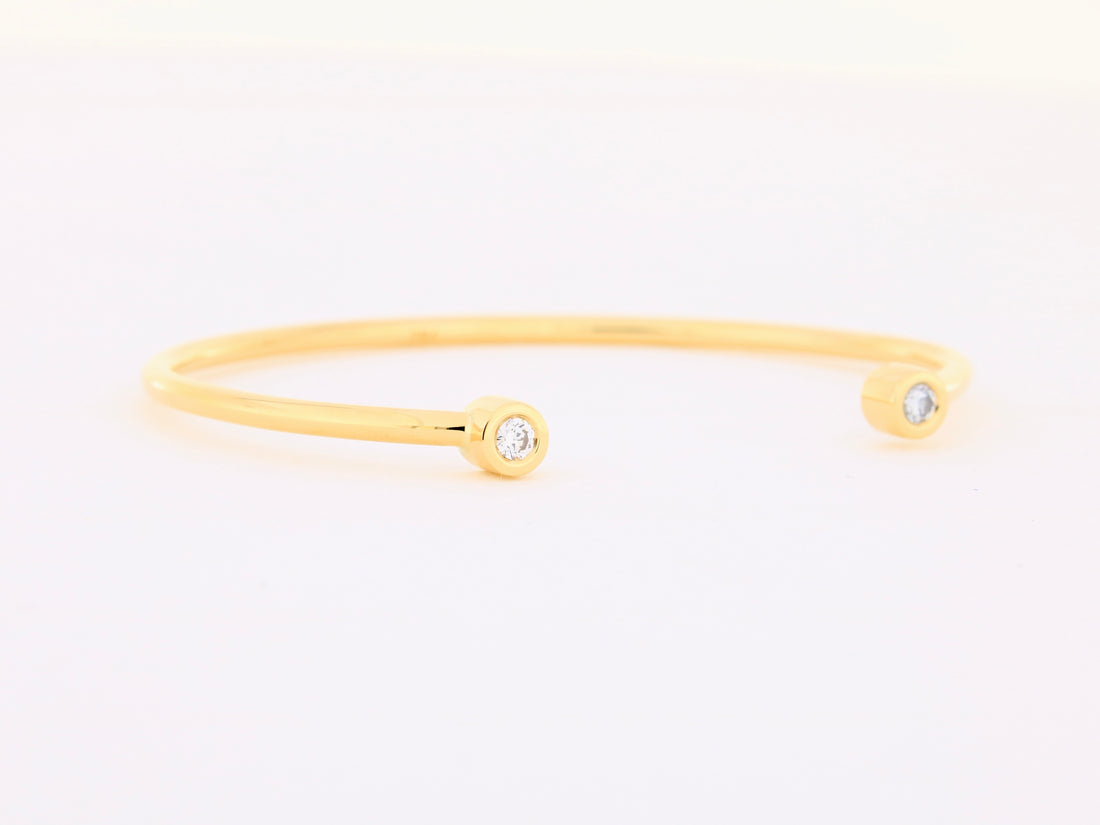 Armspange aus 18kt Gelbgold mit zwei Brillanten