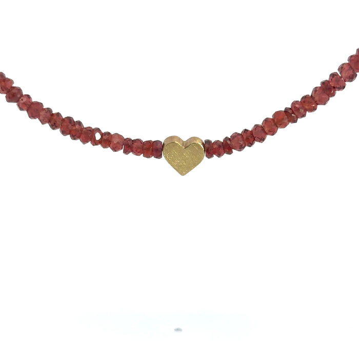 Kette aus 18kt Gelbgold mit facettiertem Granat und Herzanhänger